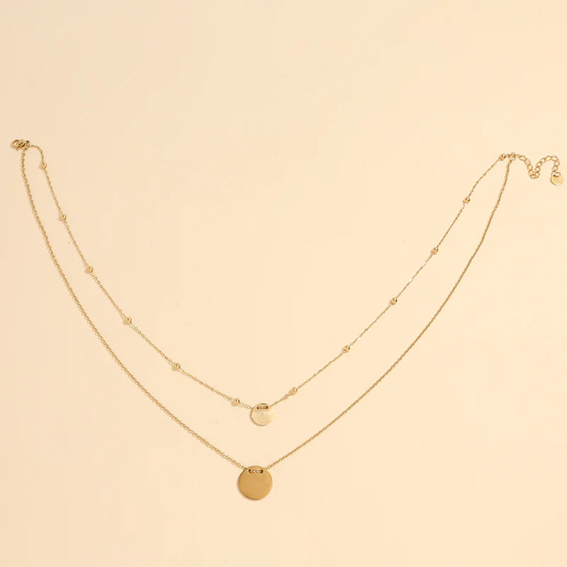 Collier double chaîne avec pendentifs ronds