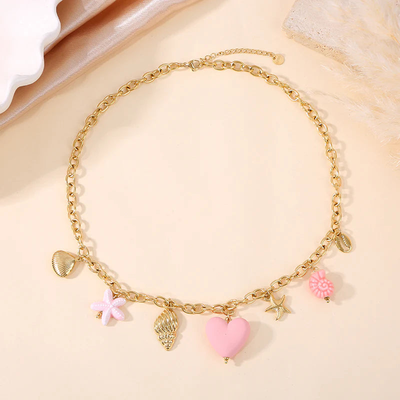 Collier doré breloques mer colorée rose