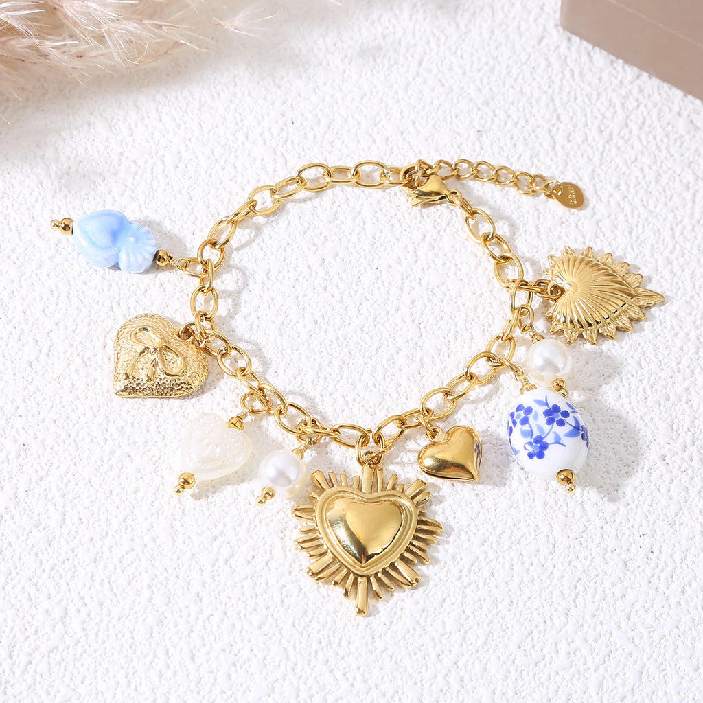 Bracelet chaîne dorée cœur ex-voto avec perle fleurs bleues
